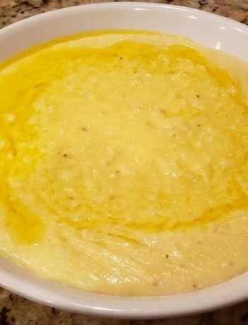 cheese grits in a bowl with butter melted on top