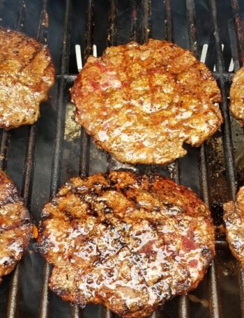 six burgers on a grill