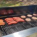 hotdogs and hamburgers on a grill